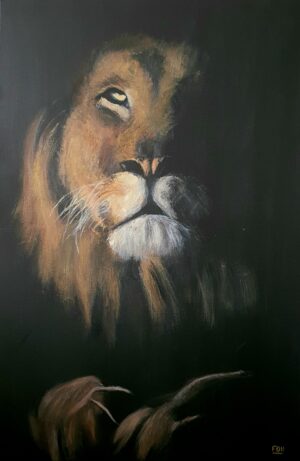 Lion emerging from darkness